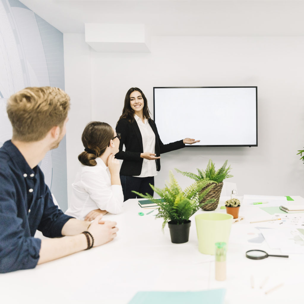 business-partners-looking-female-manager-giving-presentation